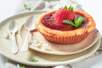 Sweet and yummy strawbery cheesecake with red jelly