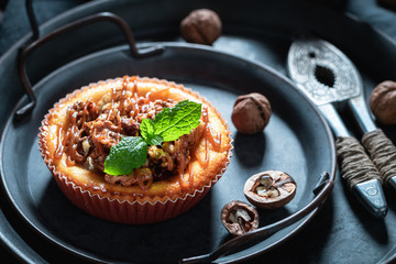 Brown and homemade walnut cheesecake made nuts and caramel