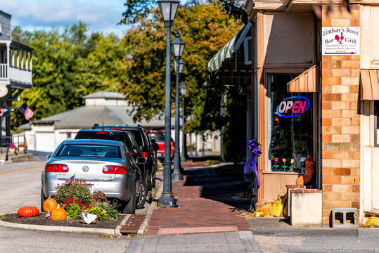 Hot Springs, USA - October 18, 2019: Historic downtown town city in Virginia countryside with autumn decorations and restaurant sign
