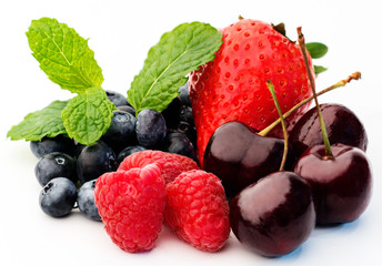 Different fresh summer berries (raspberry, cherry, blackberry, strawberry) isolated on white...
