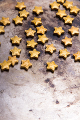 Small golden stars on a old metal background, copy space