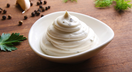 mayonnaise sauce on a wooden background cooking