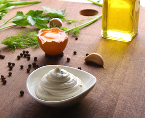 mayonnaise sauce on a wooden background cooking