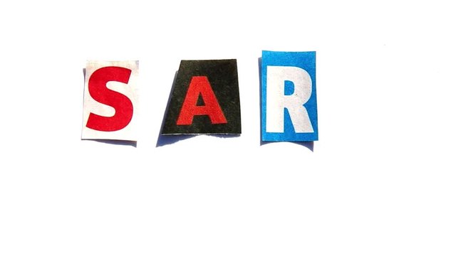 Composing the word Sars with paper letters