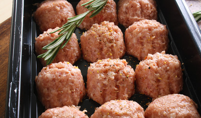 meatball forcemeat beef pork on wooden background rosemary