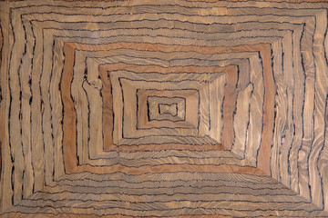 Fototapeta premium wooden gray plate with yellow light and dark fibers and a triangular relief. rough surface texture