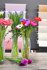Flower Studio. Bouquet in a glass vase. Bright fresh flowers indoor
