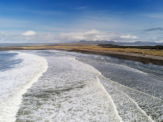 Atlantic ocean, Strandhill beach, Aerial view, Cloudy sky, sunny day, Powerful waves in the ocean, county Sligo Ireland.