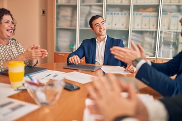Business lawyers workers meeting at law firm office. Professional executive partners working on finance strategry at the workplace. Clapping to each other for successful achievement.