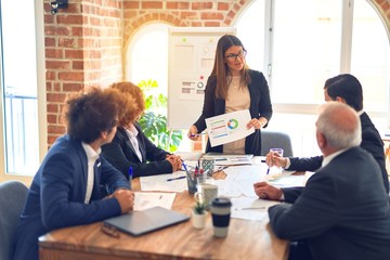 Group of business workers working together in a meeting. Listening one of them speaking at the office.