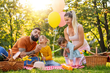 Happy family in the park together on a sunny day