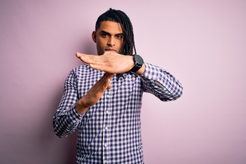 Young handsome african american afro man with dreadlocks wearing casual shirt Doing time out...