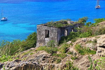 Fototapeta na wymiar Block guard house overlooking Deep Bay near Old Fort Barrington, Five Islands Peninsula between Deep Bay and St. John’s Harbour, Antigua Barbuda Lesser Antilles, West Indies, Caribbean, Goat Hill.