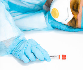 Fototapeta premium An exhausted doctor rests after hard work with coronavirus. The concept of fighting the coronavirus epidemic, COVID 19. Attempt to eliminate the SARS pandemic. Fighting the world against epidemics.