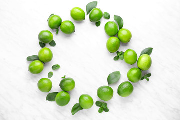 Fresh limes on light background