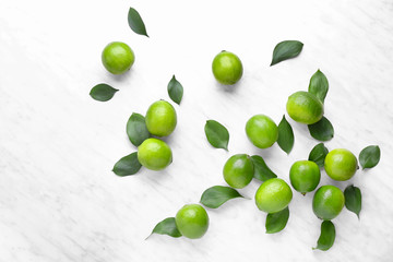 Fresh limes on light background