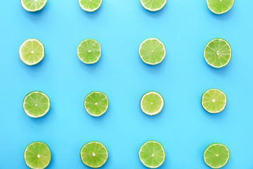 Fresh limes on color background
