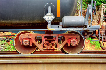 Steel wheels on train railcars.