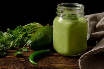 Green smoothie vegetables on the black background
