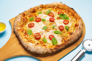 Delicious pizza Margherita on color background
