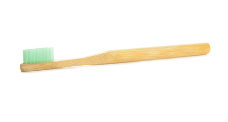 Wooden tooth brush on white background