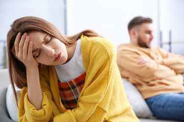 Unhappy woman after quarrel with her boyfriend at home. Relationship problems