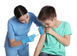 Obraz premium Doctor vaccinating little child on white background