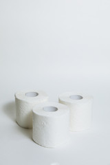 A supply of several rolls of toilet paper in case of an epidemic. COVID-19 coronavirus outbreak concept. Shortage due to buying panic. White background, copy space