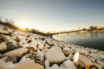 Snowy Rock Boulders with River and Sky