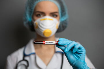 Nurse holding Blood Sample. 