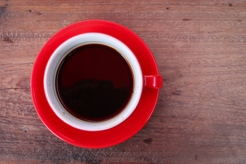 Top view Black coffee in a red coffee cup on a wooden background