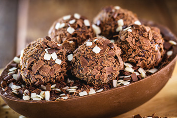 brazilian easter egg. Easter with refined chocolate, covered with brigadeiro sweets. Black and white chocolate.