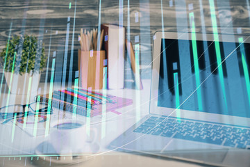 Financial market graph hologram and personal computer on background. Double exposure. Concept of forex.