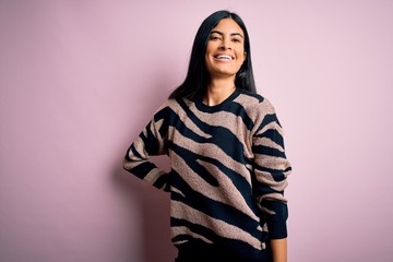 Fototapeta premium Young beautiful woman wearing fashion urban clothes, model wearing casual street style standing over pink background