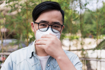 Asian men wearing medical masks on the streets of the city