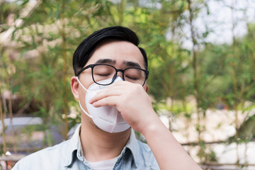 Asian men wearing medical masks on the streets of the city