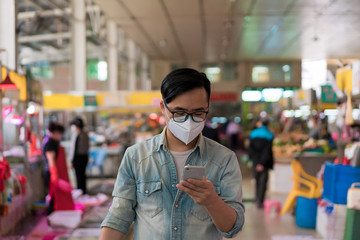 Asian men shopping at the food market