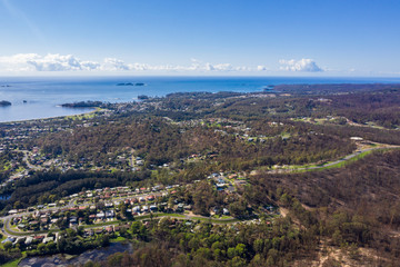 Panoramic aerial drone view of Batemans Bay on the New South Wales South Coast, Australia, looking out to Tasman Sea on a sunny day   