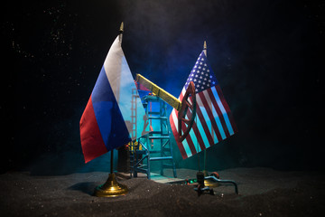 Business dialogue, oil agreement concept: National flags with Oil pump and oil refining factory at...