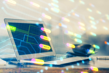 Double exposure of desktop computer and technology theme hologram. Concept of software development.