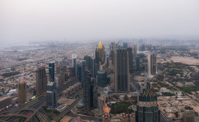 DUBAI, UAE - may 2019: Aerial view of Downtown Dubai with man made lake and skyscrapers from the tallest building in the world, Burj Khalifa, at 828m