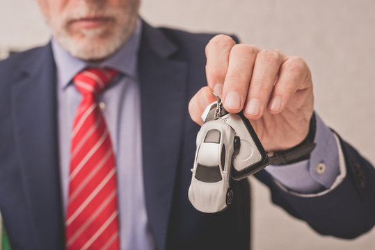 businessman holding key