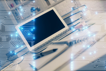 Computer on desktop in office with technology theme hologram. Multi exposure. Tech concept.