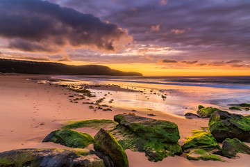 Clouds and Green Mossy Rocks Sunrise Seascape