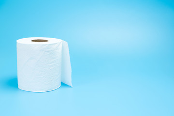 One toilet paper roll isolated on blue background