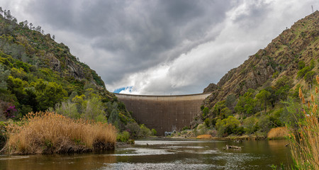 Lake Berryessa Dam and mountains in Winters Ca. on a cloudy day