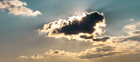 Clouds with sunlight in a blue sky