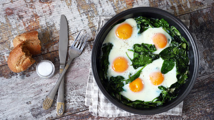 keto diet. Healthy omelet with spinach. Eggs with spinach in a frying pan.