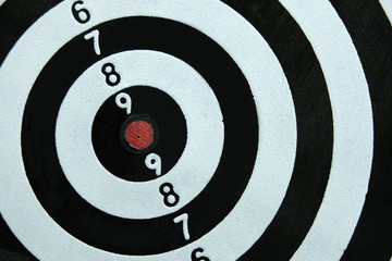 Conceptual photo of business strategy / accuracy - a red arrow that sticks directly in the center...