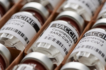 Bottles coronavirus vaccine. sars-cov-2 / COVID-19. Some ampoules with ncov-2019 vaccine in a box....